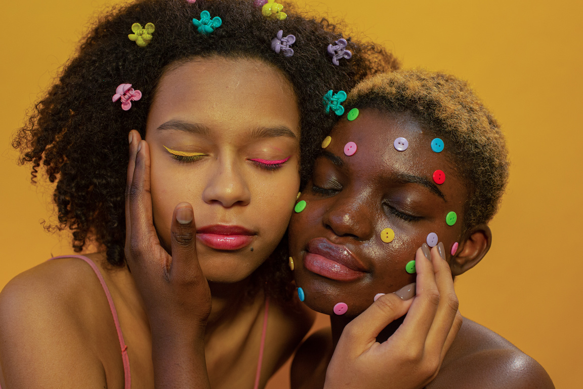 Black women with colorful hairpins and buttons